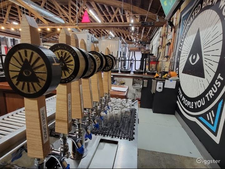 8 tap handles of Illuminated Brew Works beer.