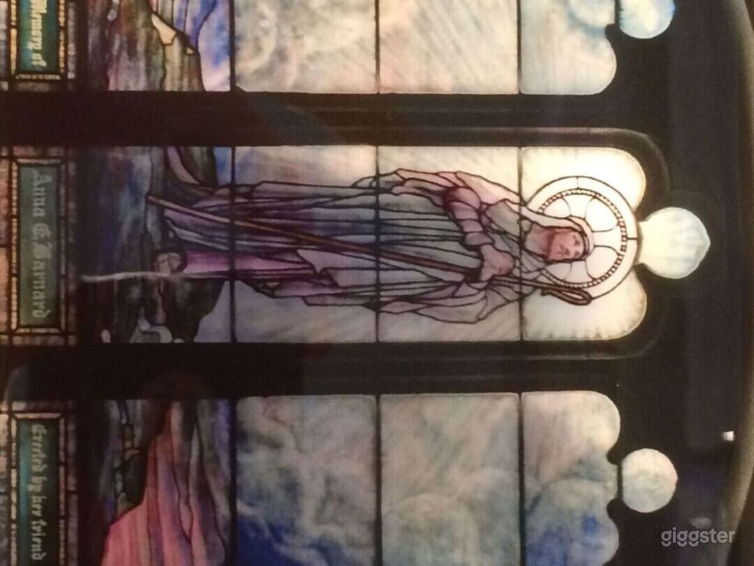 Stain glass window above Alter