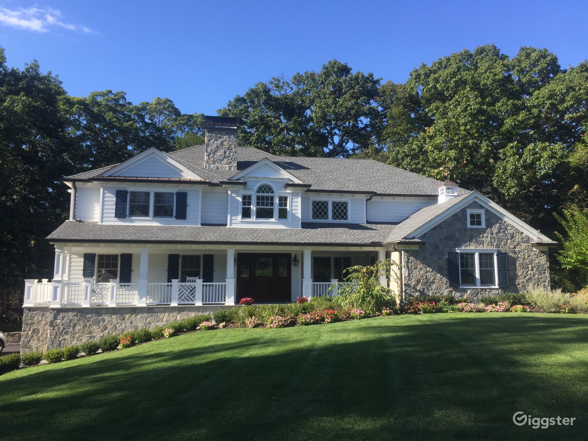 Timeless White Clapboard House with stone features Rent this location