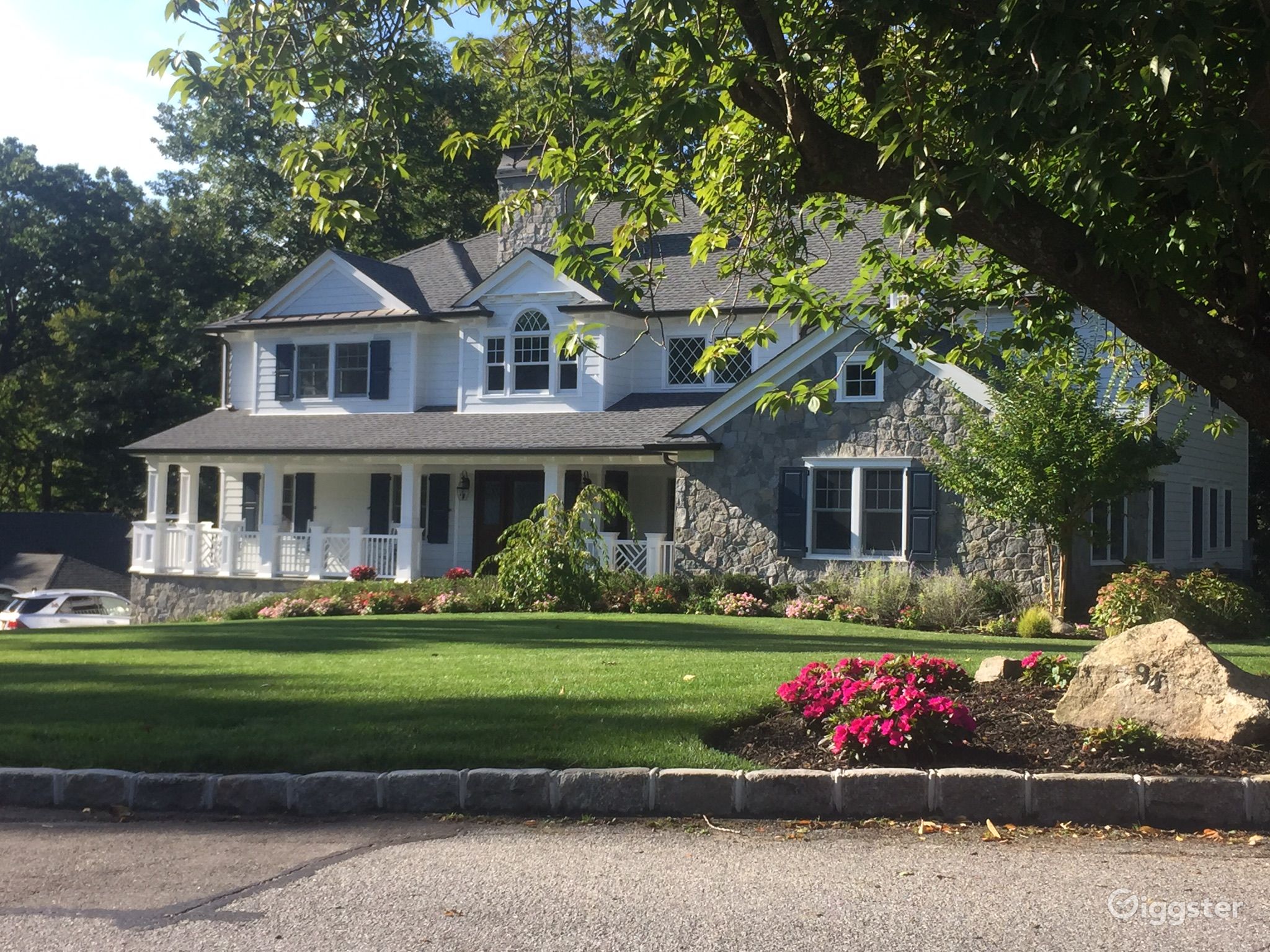 Timeless White Clapboard House with stone features Rent this location