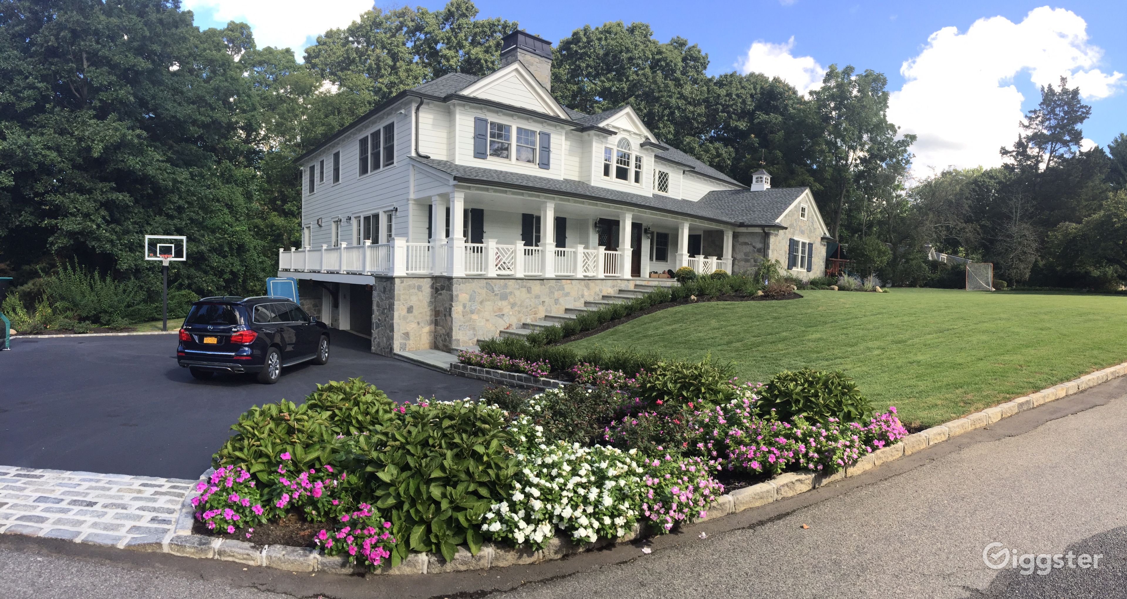 Timeless White Clapboard House with stone features Rent this location