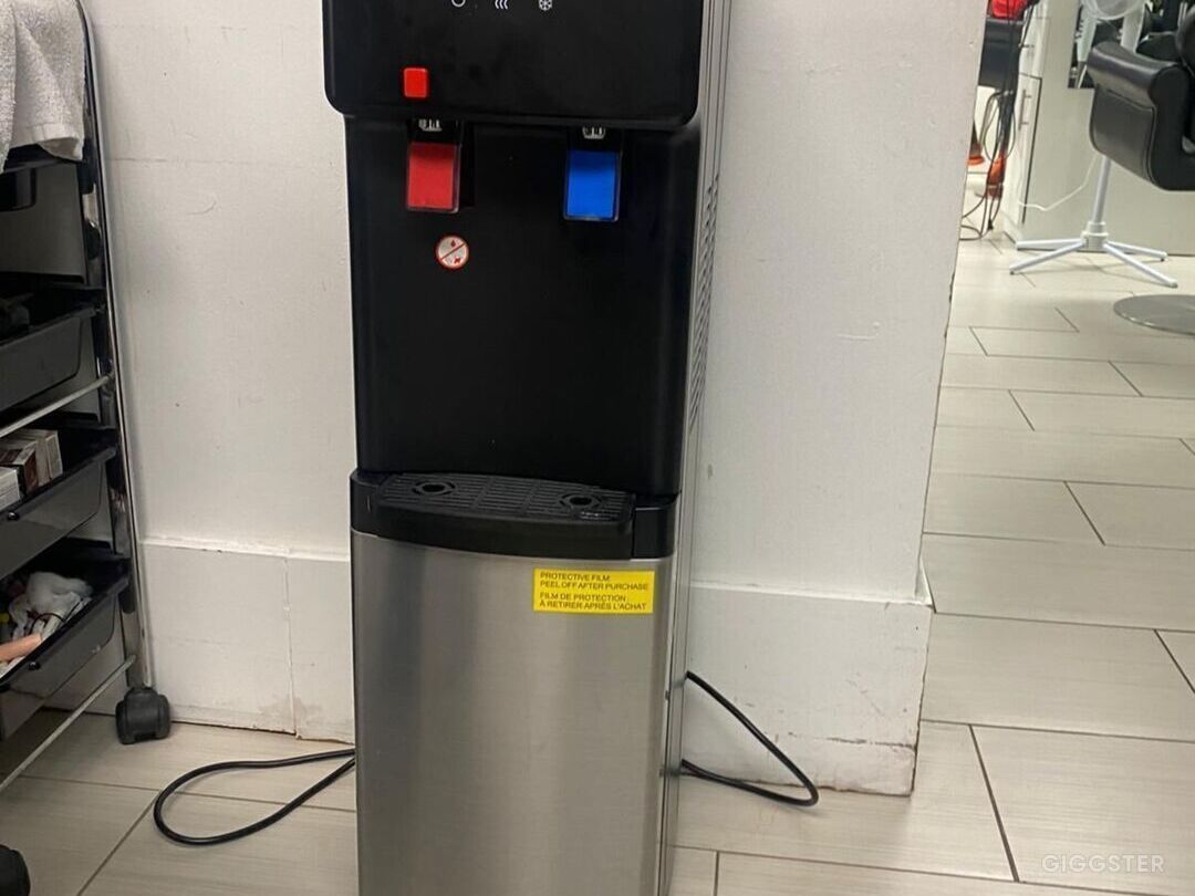 Water dispenser located upstairs. Can be used by film crew, just bring own water jug.