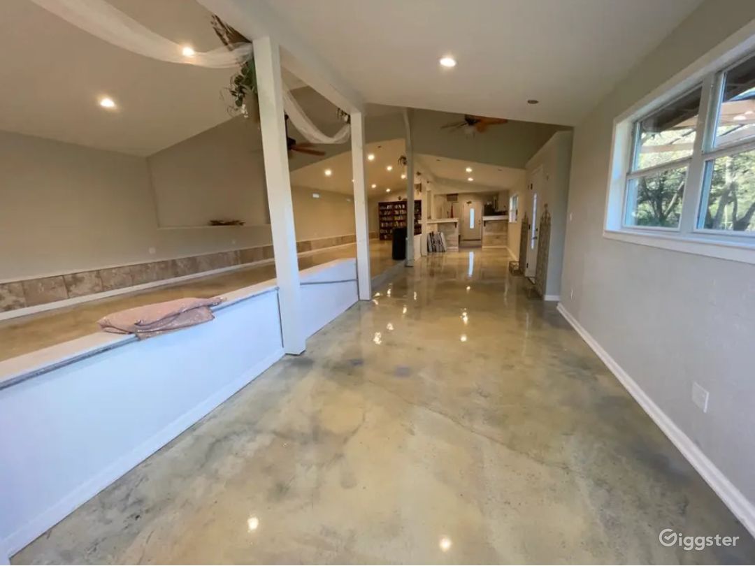Inside of reception hall showing kitchen area at far end