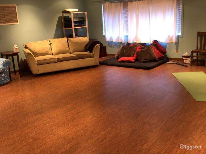 600 sq ft. room we call The Great Room, has a sound system, some yoga props, chairs and foam cushions.