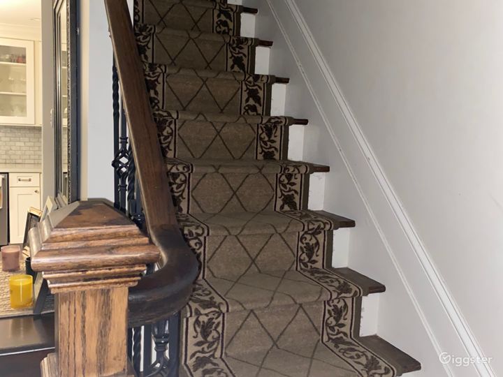 front stairwell- leads up to two bedrooms and a bathroom