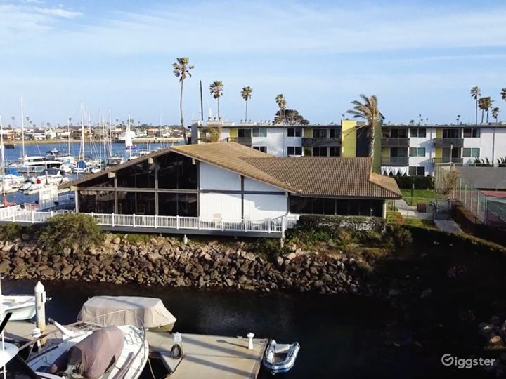 Exterior of the clubhouse and a view of the deck/patio area.