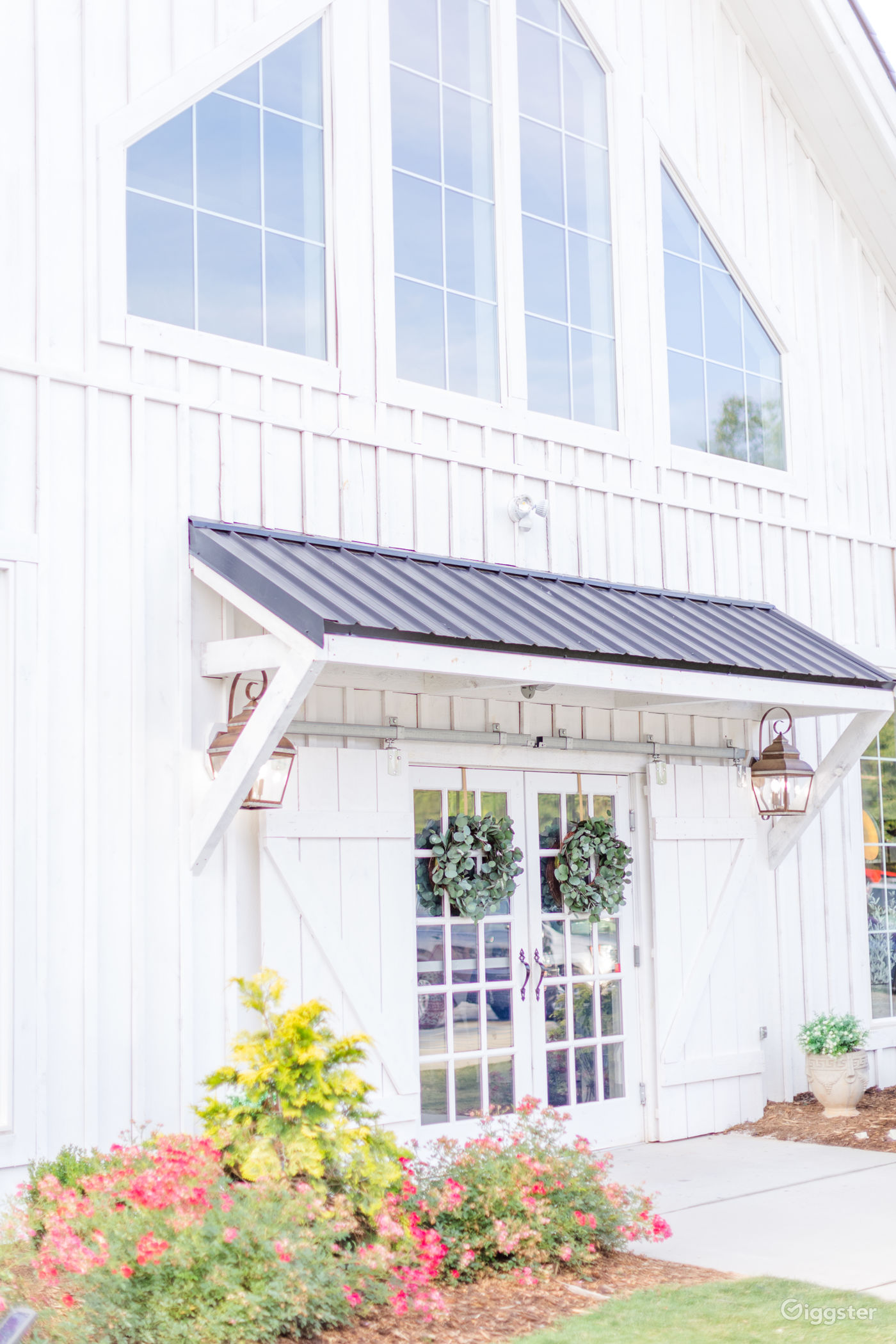 An allwhite postandbeam wedding & event venue Rent this location