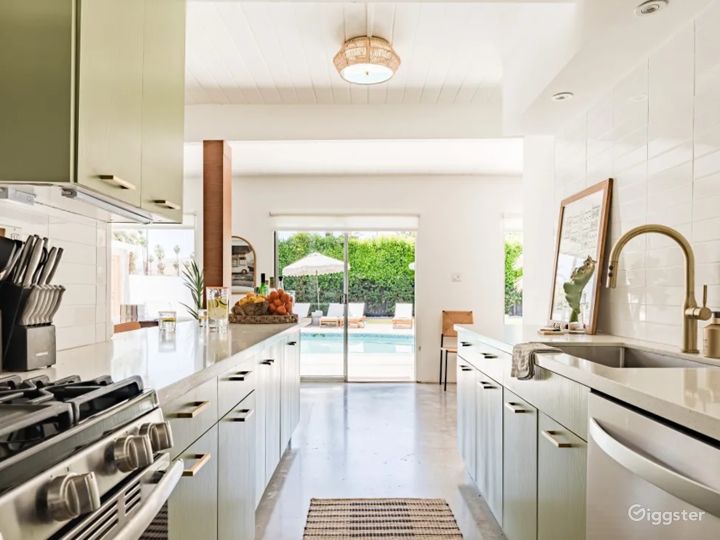 A fully equipped kitchen with views of the outdoor entertaining area.