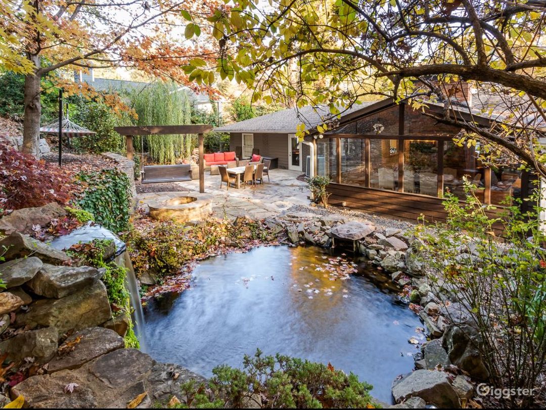 Backyard with firepit, waterfall and koi pond