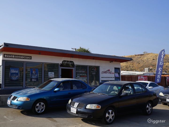 Rural used car dealership, antique store, on HWY! Rent this location on Giggster