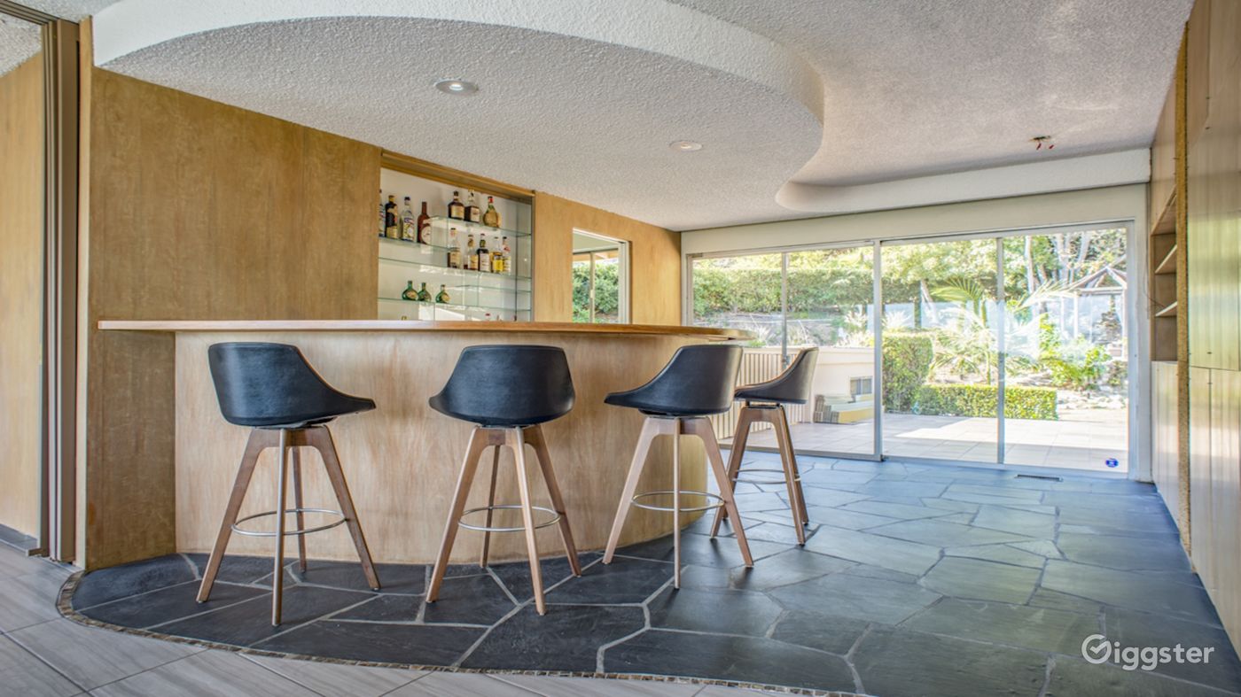 Bar and Exterior Patio connected with Black Stone Floors