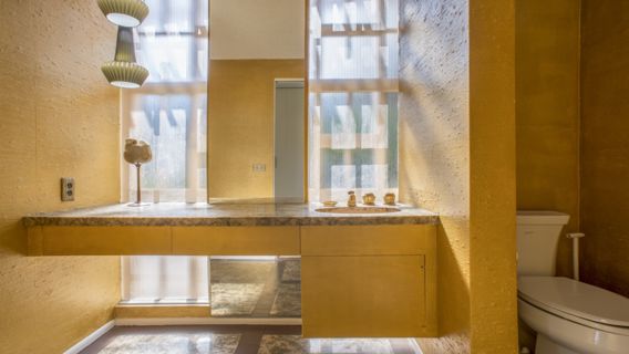 Gold splashed Powder Room with original 60' details