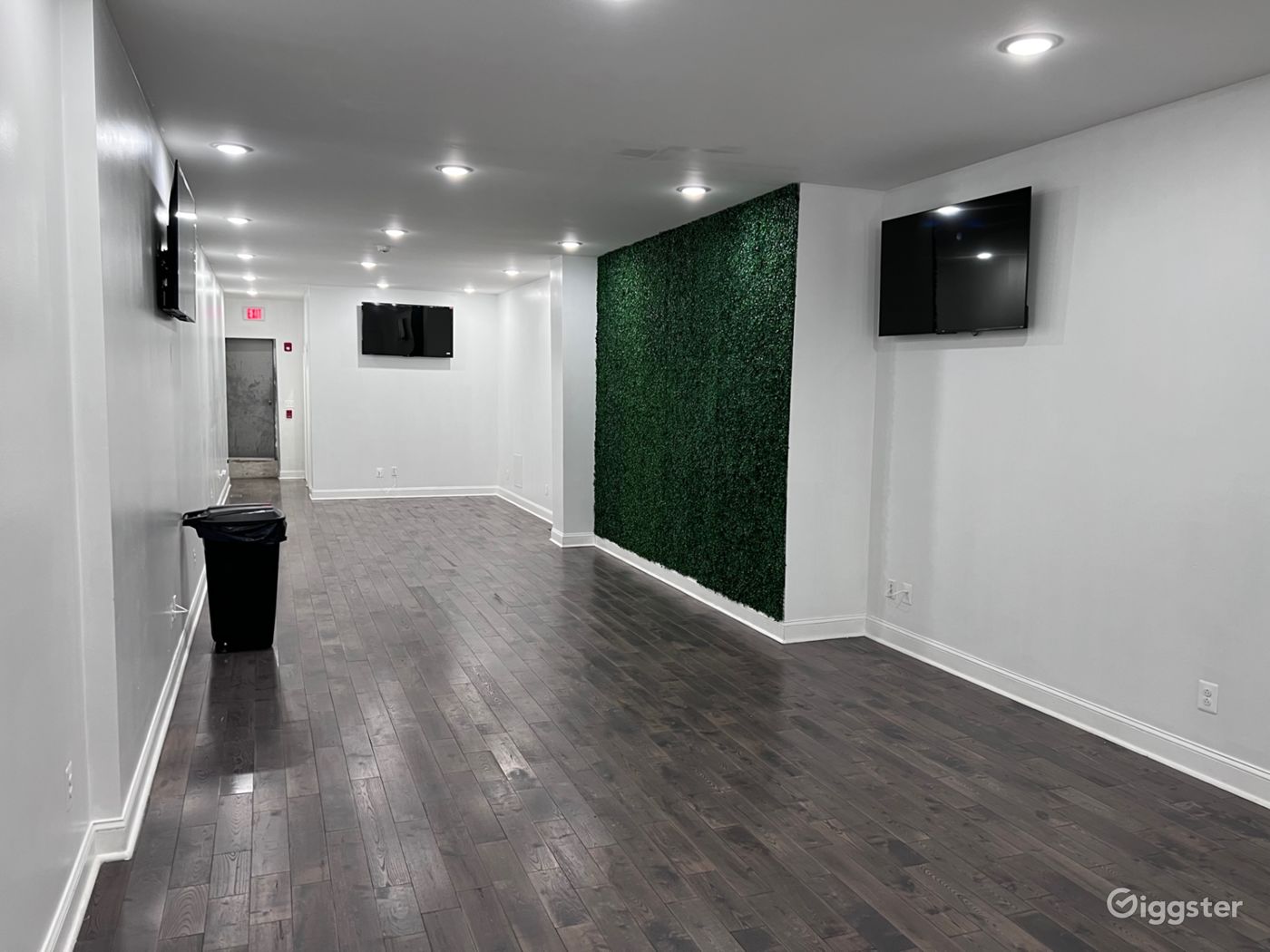 Spacious updated venue with grass wall! Rent this location on Giggster