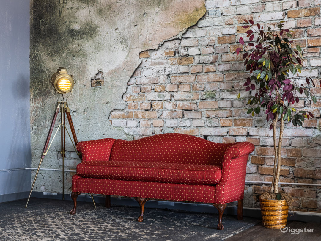  Red couch by the brick wall 